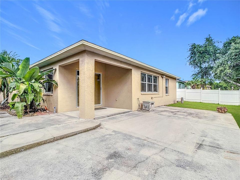 Charming backyard boasts an oversized 13x33 rear concrete patio, ideal for entertaining family and friends.