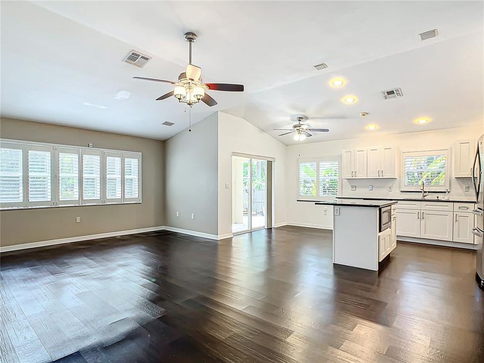 Plantation shutters with granite windowsills in kitchen and living room.