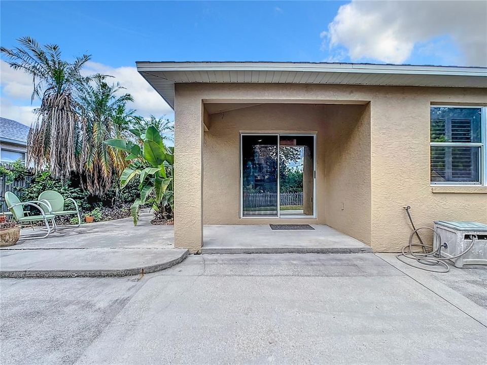 Charming backyard boasts an oversized 13x33 rear concrete patio, ideal for entertaining family and friends.