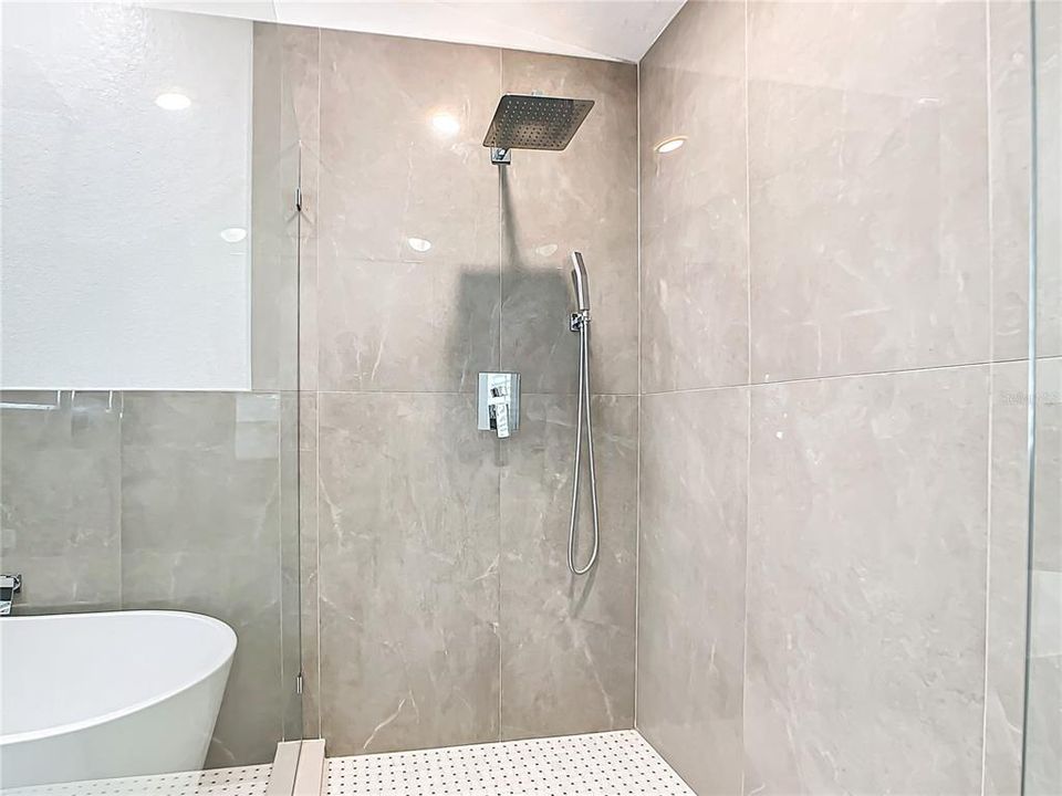 The En-suite primary bathroom has been beautifully remodeled with a soaking tub and separate shower.