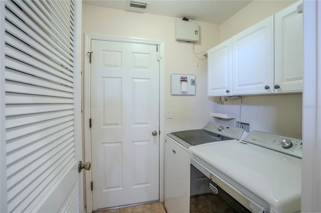 Laundry Room and Door to oversized Garage