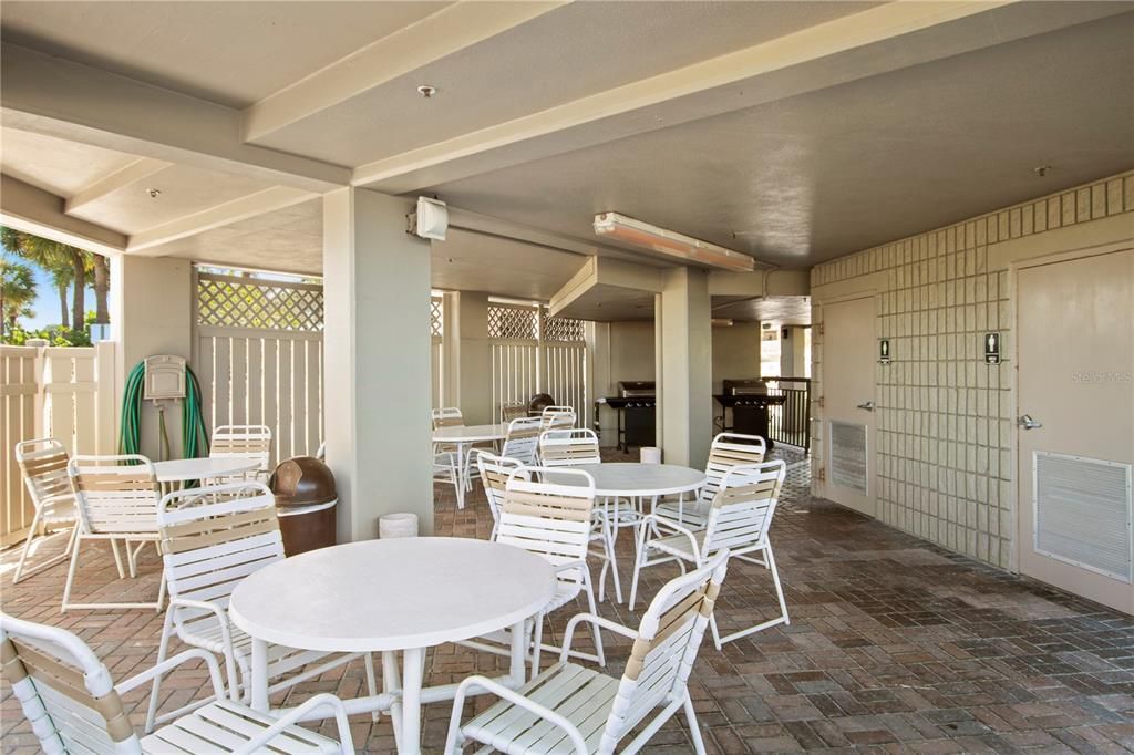 Poolside covered patio with gas grills