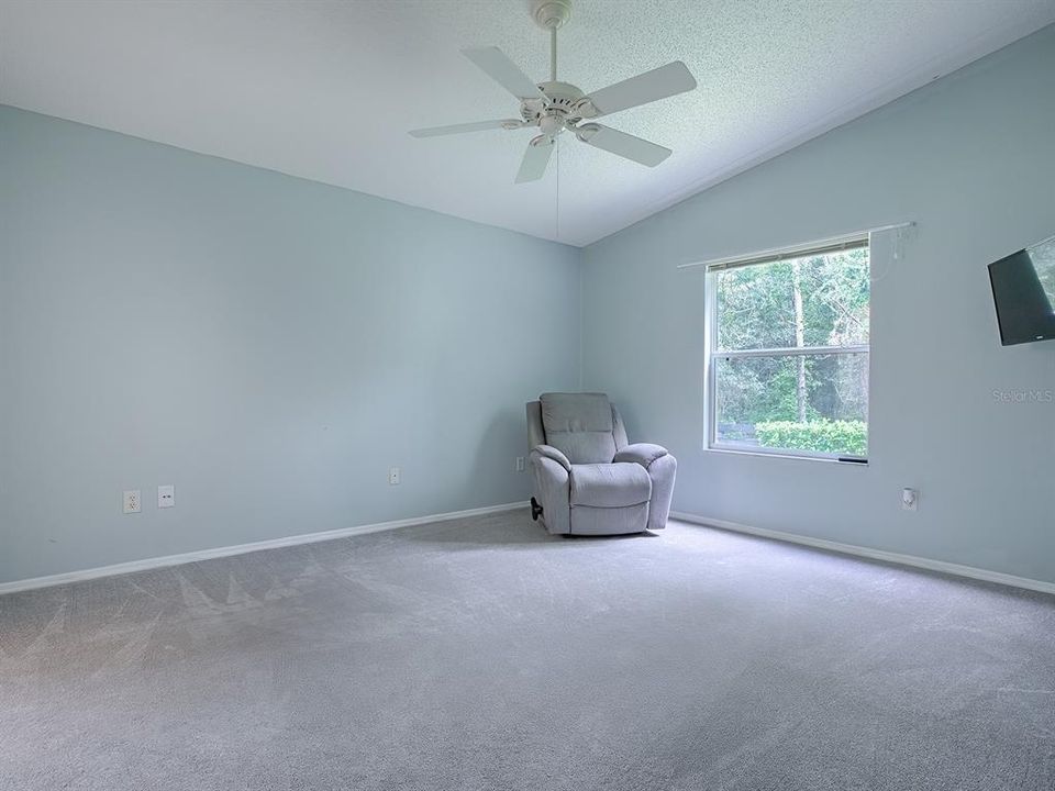 Master bedroom with view to the private back yare