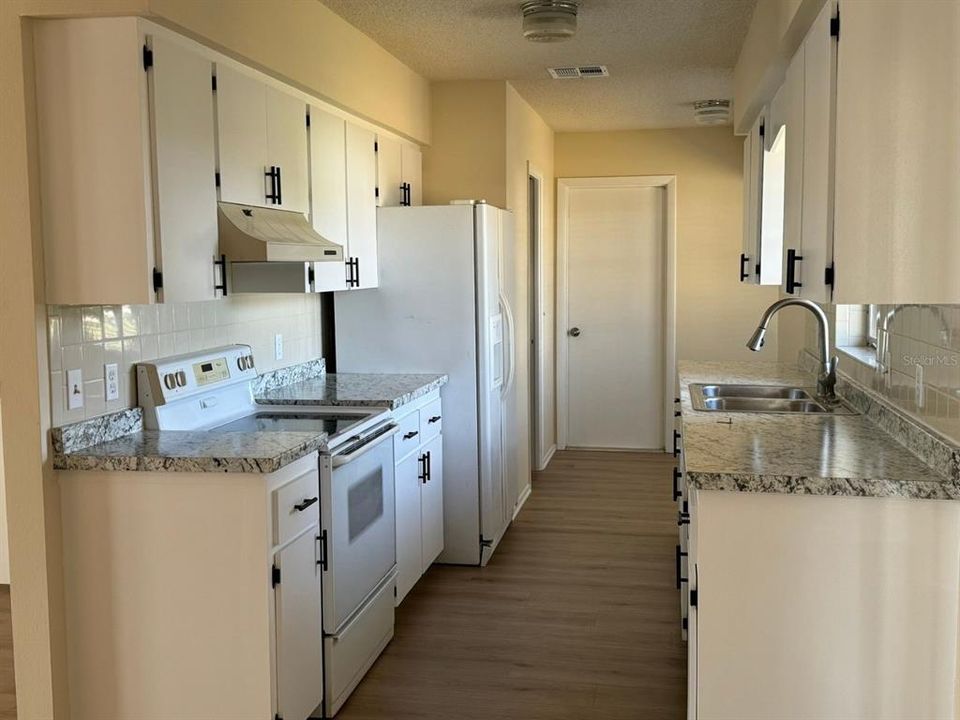 Kitchen with view of breakfast nook area