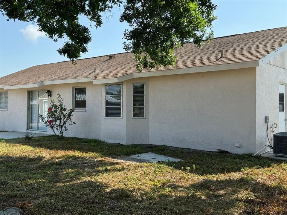 Back of home with patio