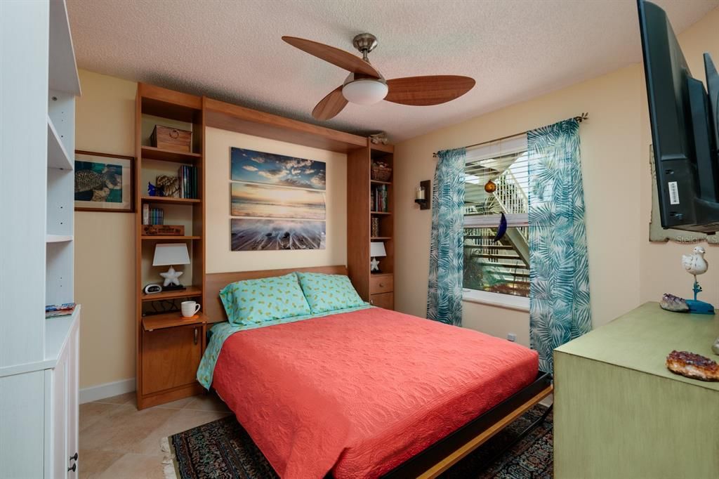 GUEST BEDROOM WITH MURPHY BED DOWN.