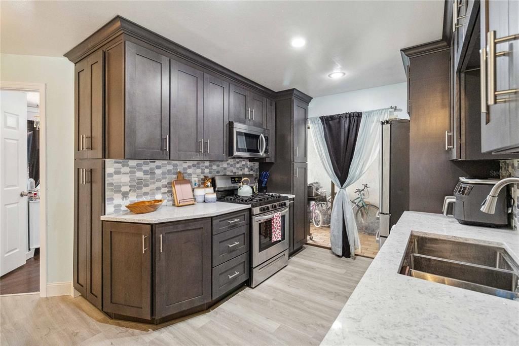 New cabinets, solid surface and stainless steel appliances