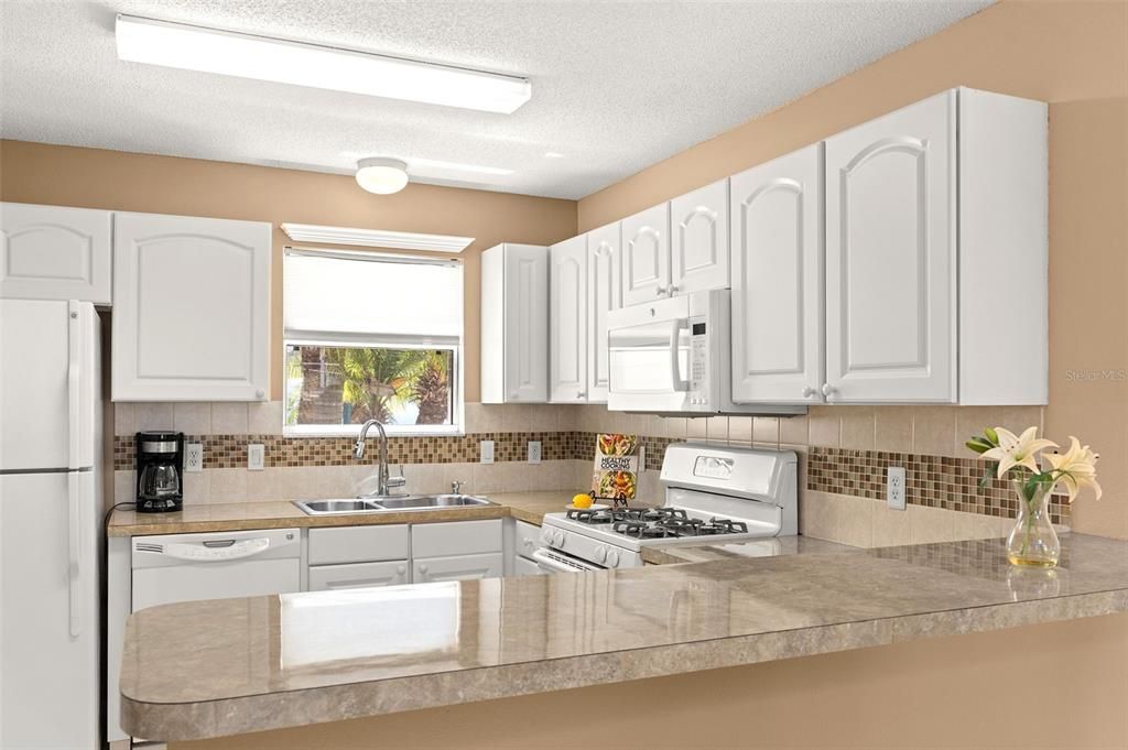 Nice Neutral Tones with White Cabinets Can Be Found in the Kitchen!