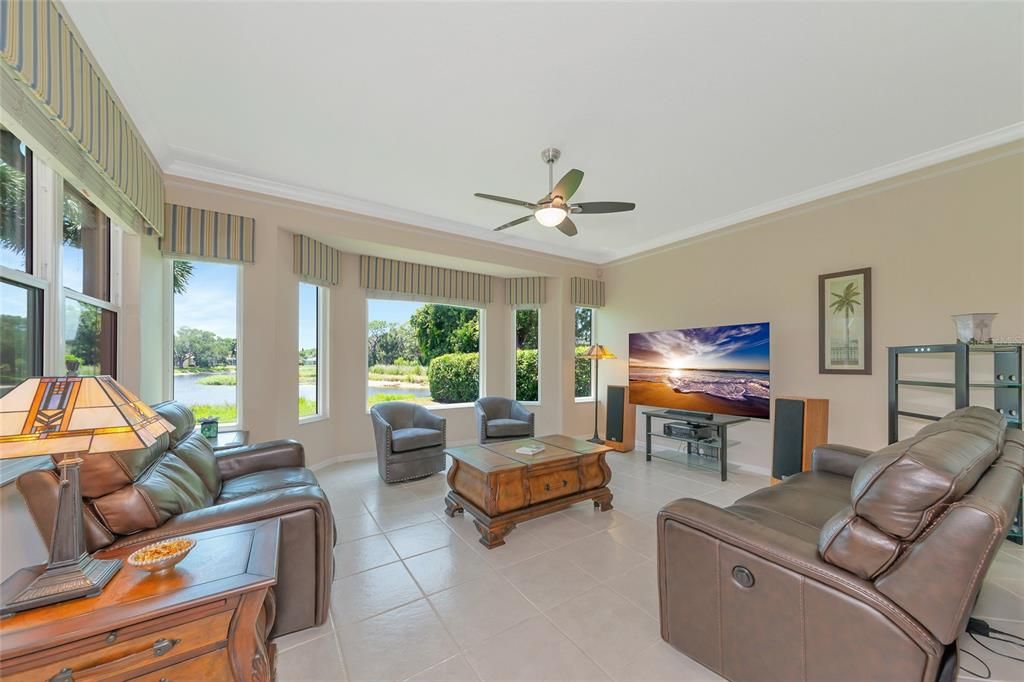 Grand family room w/ large bay window lake & preserve view.