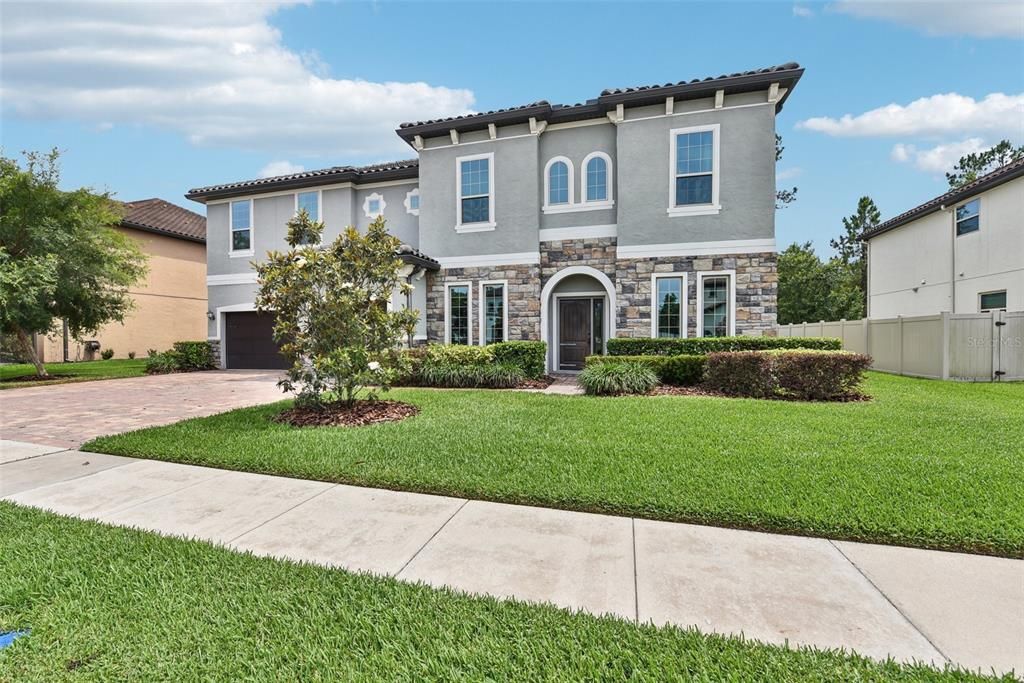 Welcome to YOUR DREAM HOME at 2353 Brickell Place in OVIEDO’S UPSCALE, GATED COMMUNITY of HAMPTON ESTATES!