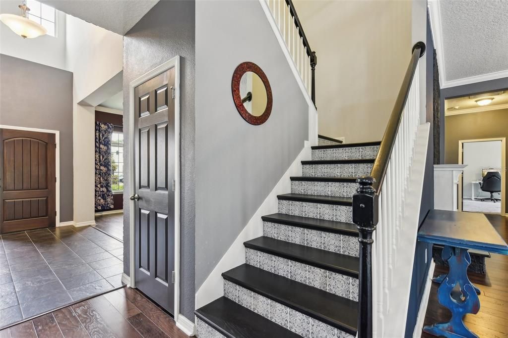 WOOD STAIRS with CUSTOM TILE WORK, then you are IMMEDIATELY GREETED with an OVERSIZED LOFT that measures over 450 sqft! The LOFT is PERFECT for a GAME ROOM, MOVIE ROOM, BILLIARDS ROOM, a COMBINATION of those things or just a RELAXING SPOT to hangout and recharge!