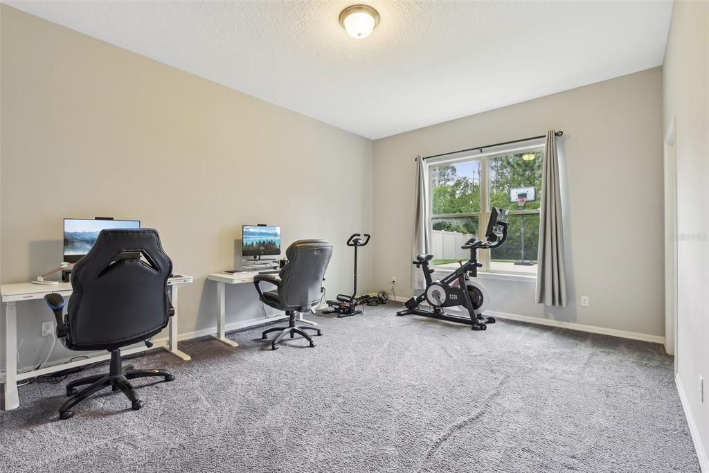 There is a LARGE DOWNSTAIRS BEDROOM that is PERFECT for MULTI-GENERATIONAL Living, a GUEST ROOM, a Teenager that needs their own space or if you want an OFFICE overlooking the pool, backyard and reserve behind the house!