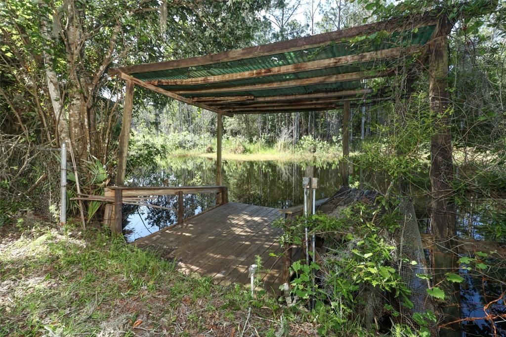 Spring fed lake with covered dock.