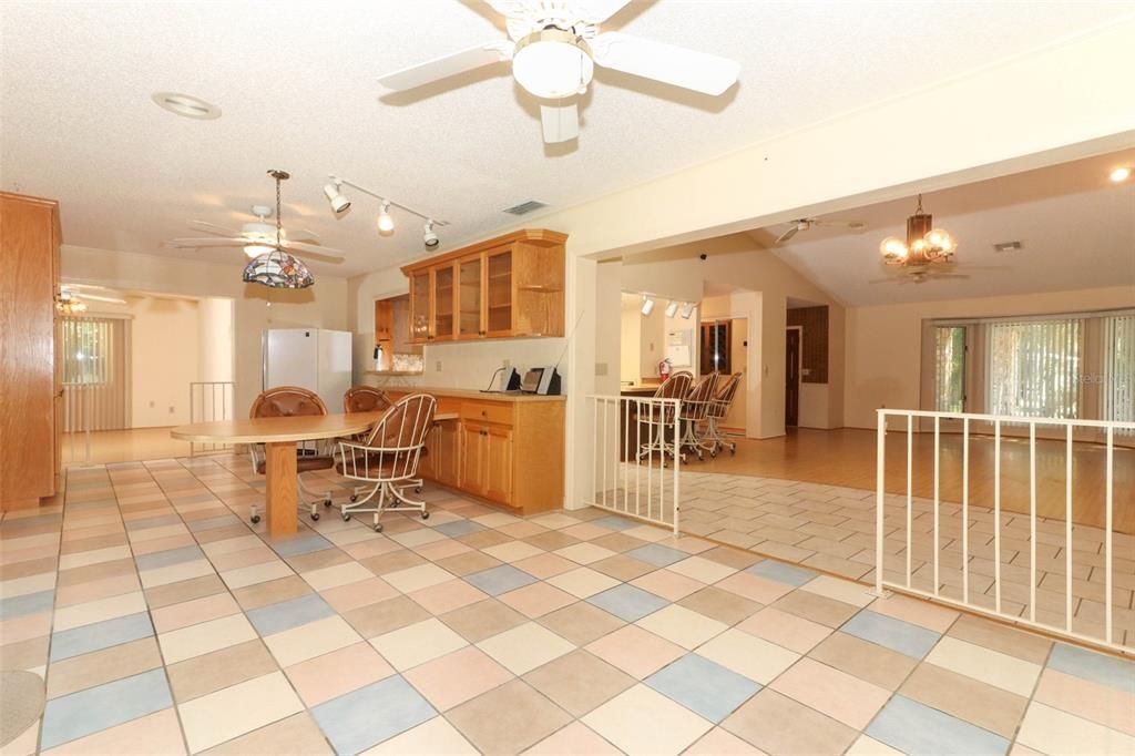 Florida room with additional table and cabinets, perfect for large dinner parties.