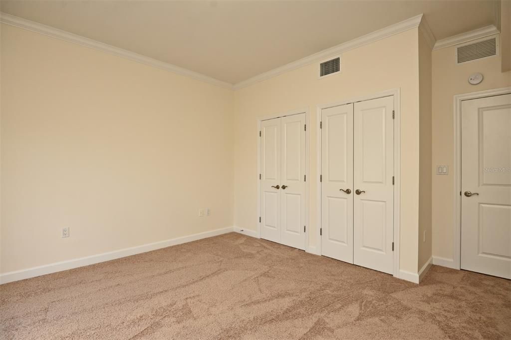 Bedroom 2 showing double closet doors Pic 1