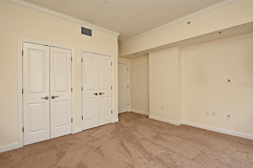 Bedroom 2 showing double closet doors Pic 1