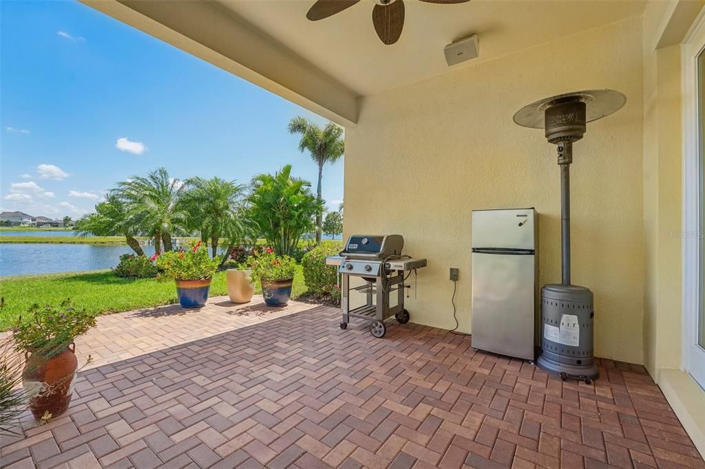 gorgeous open lanai with pavers, notice the corner landscaping for privacy