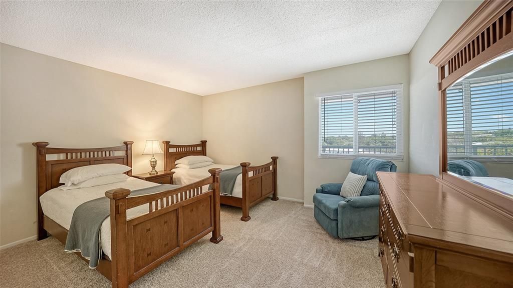 The guest bedroom is perfect for extended family, friends or renters and has a designated full bathroom and huge walk-in closet.