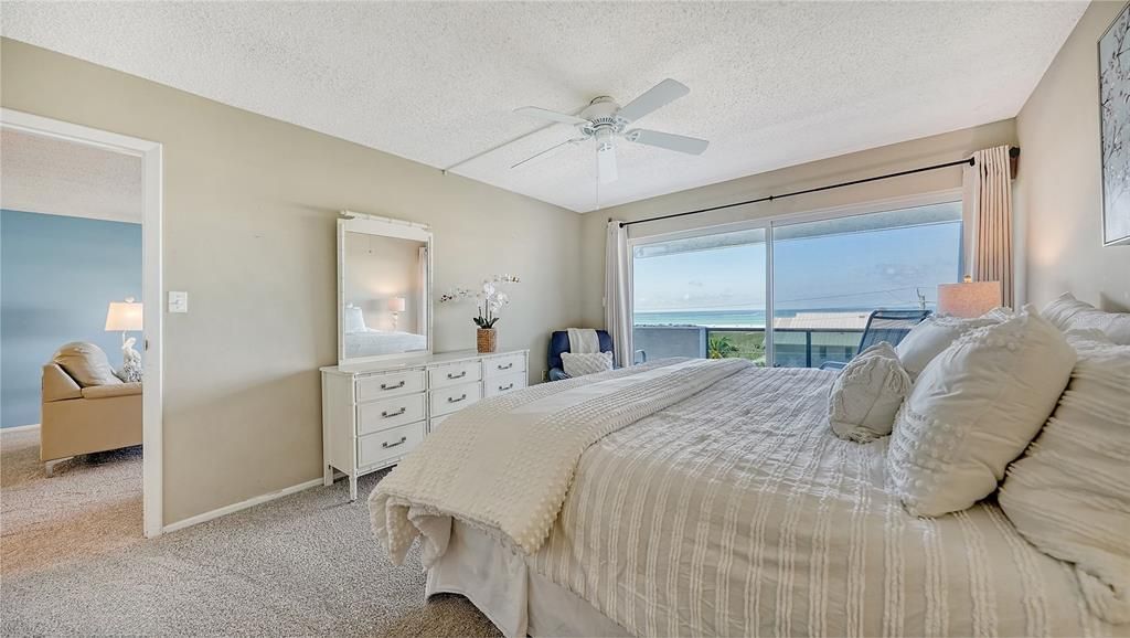 The ample owners suite boasts azure Gulf views, private terrace access, large walk-in closet with storage and an ensuite bathroom with separate vanity area.