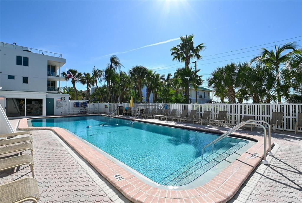 This exceptional property offers an array of amenities including a tennis/pickleball court, putting green, spacious penthouse club room, and a heated pool.