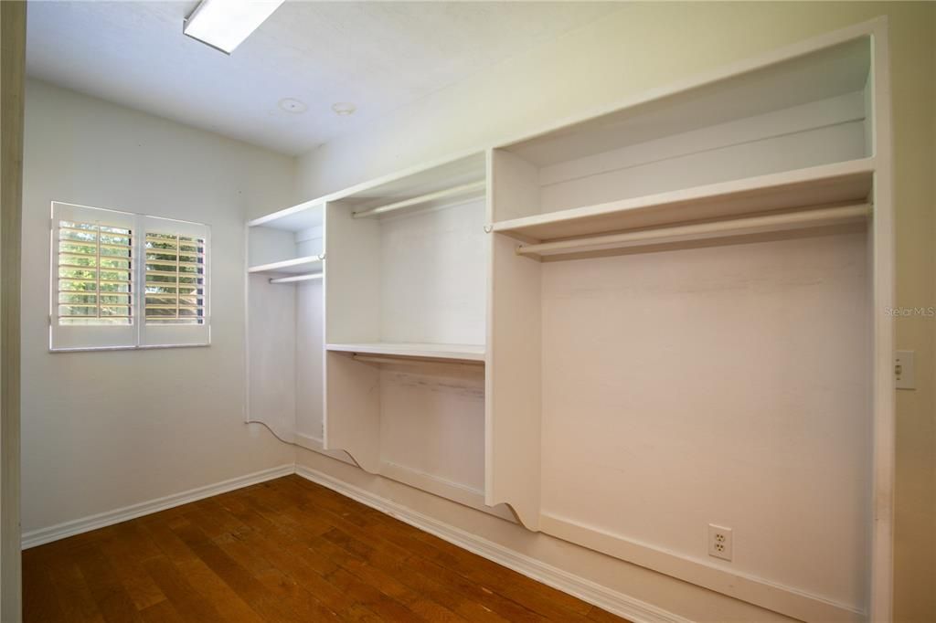 One of two Primary Bedroom walk-in closets.