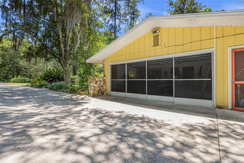 Garage with sliding screens.