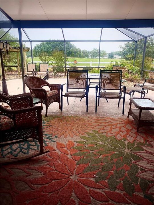 Covered and extended patio with bird cage overlooking the golf course