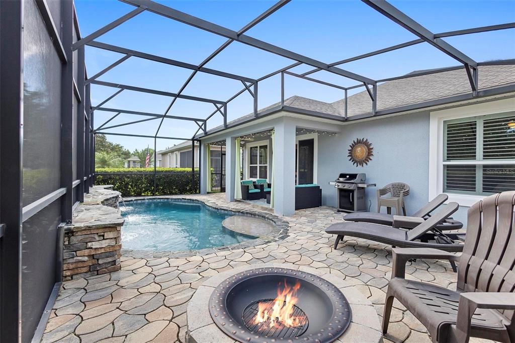 Pool area with fire pit.