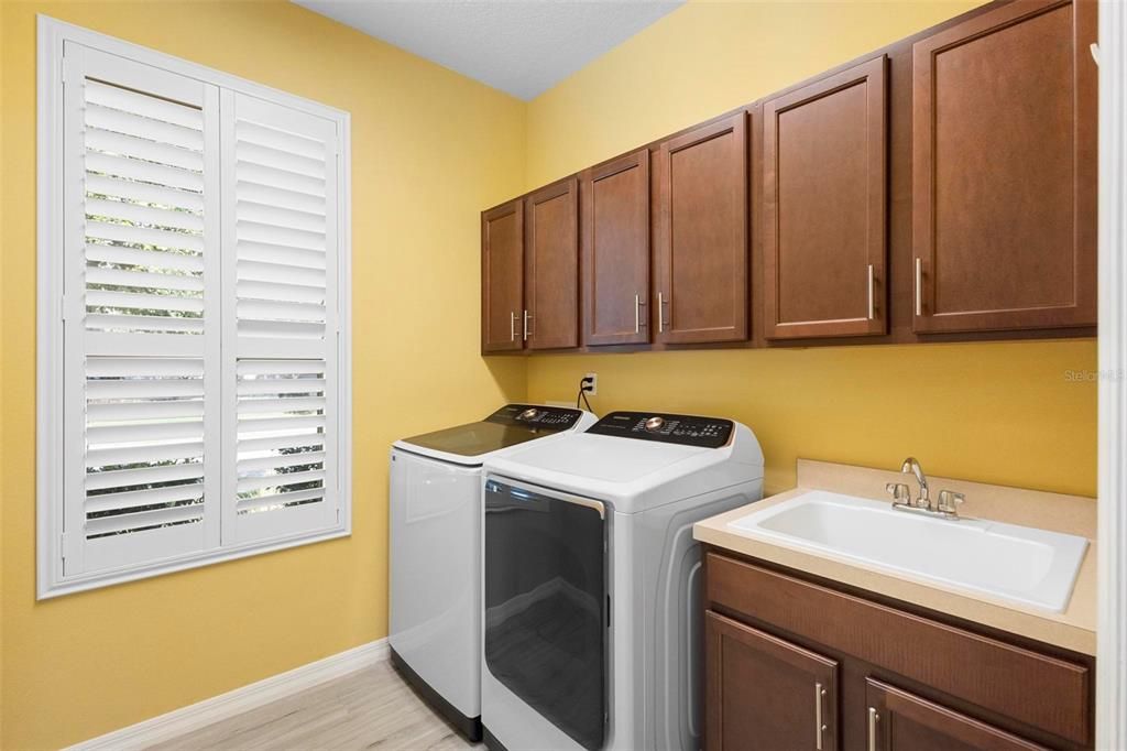 Laundry with Utility sink and cabinets