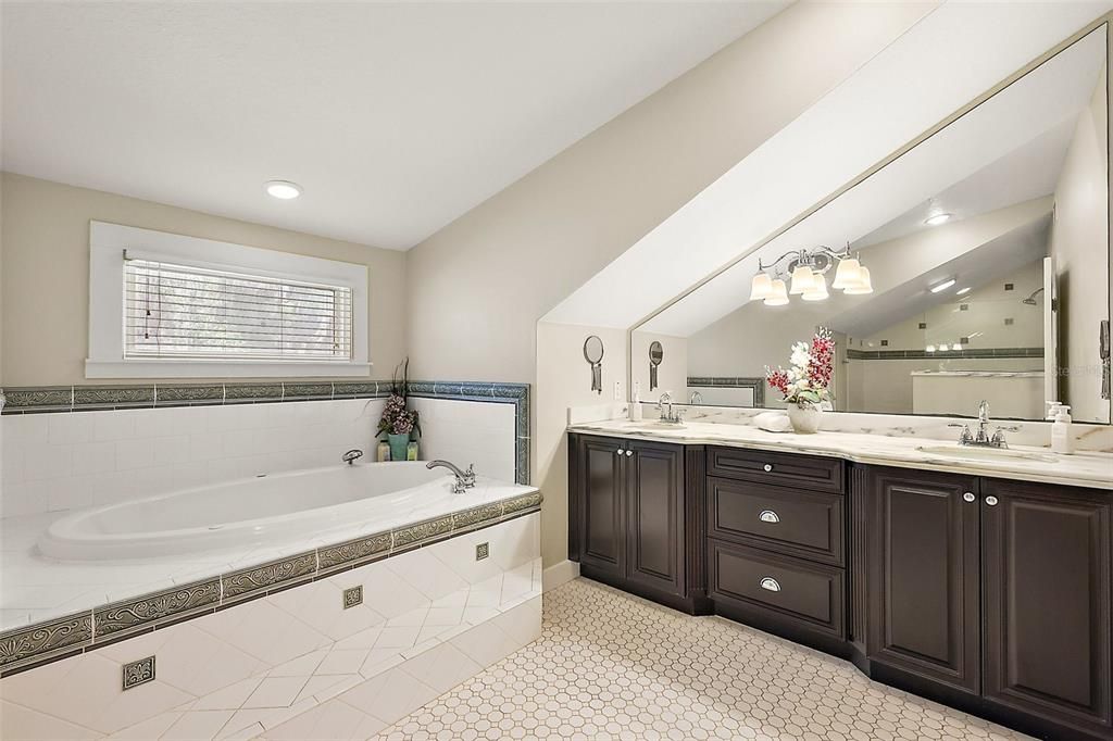Primary Bathroom with double vanity, garden tub and walk-in shower.