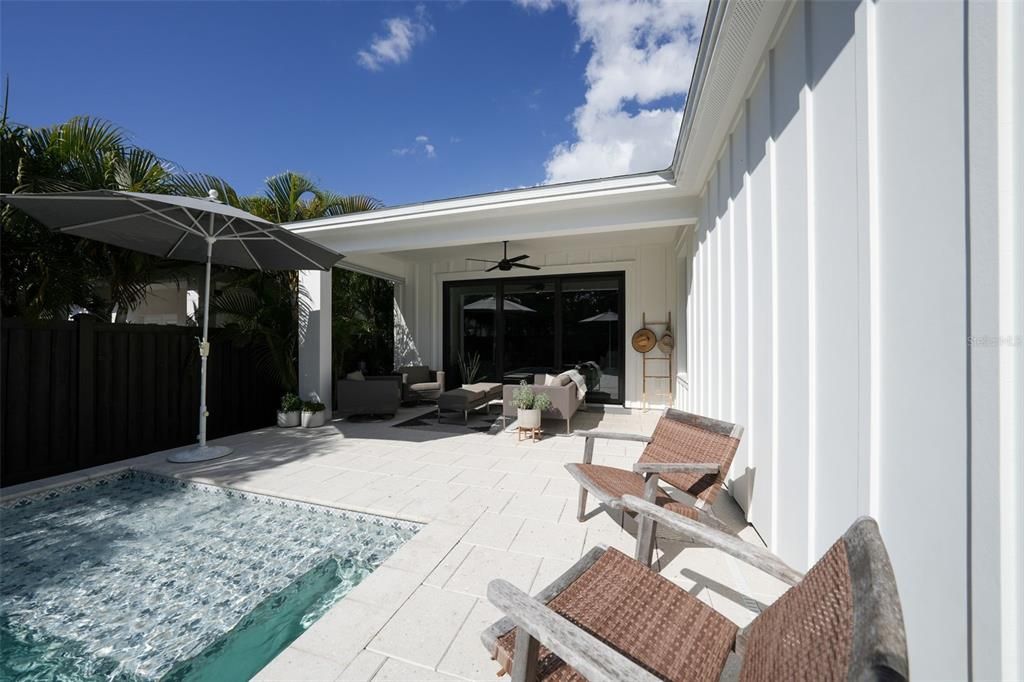 Plenty of lounge space in and out of the water!  The covered lanai provides outdoor living space and the large sunshelf in the pool is the perfect splash pad for pets and little humans.