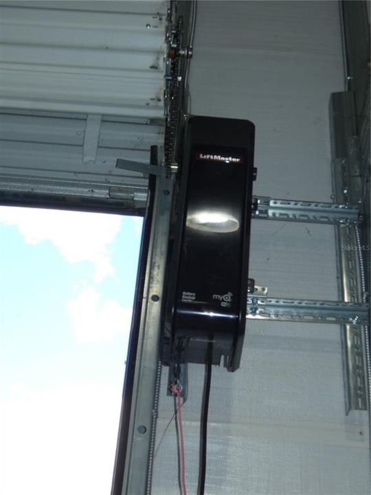 Garage Door opener on one Door.