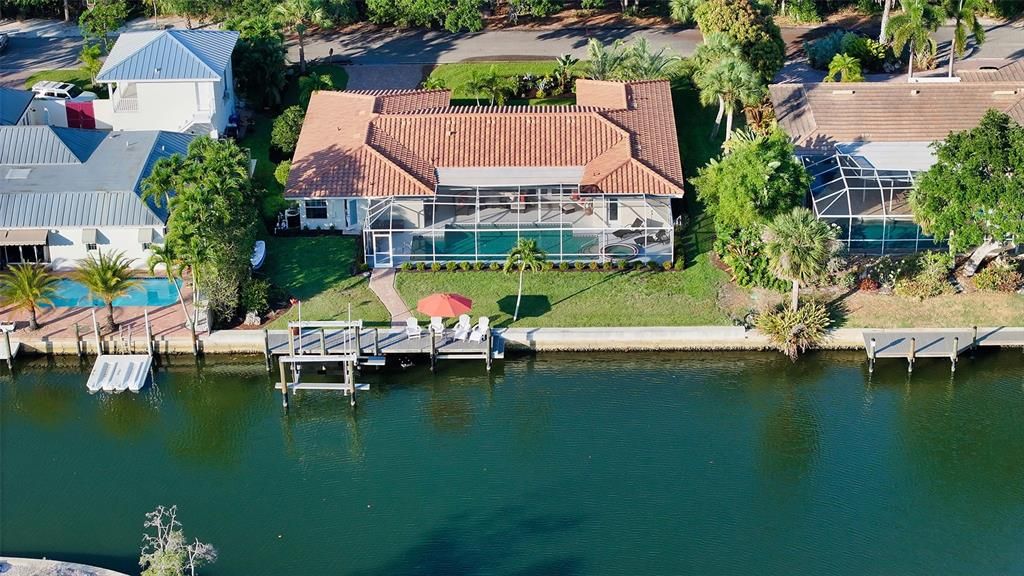 This beautifully updated home is situated on the Grand Canal, with easy access to the bay and Gulf
