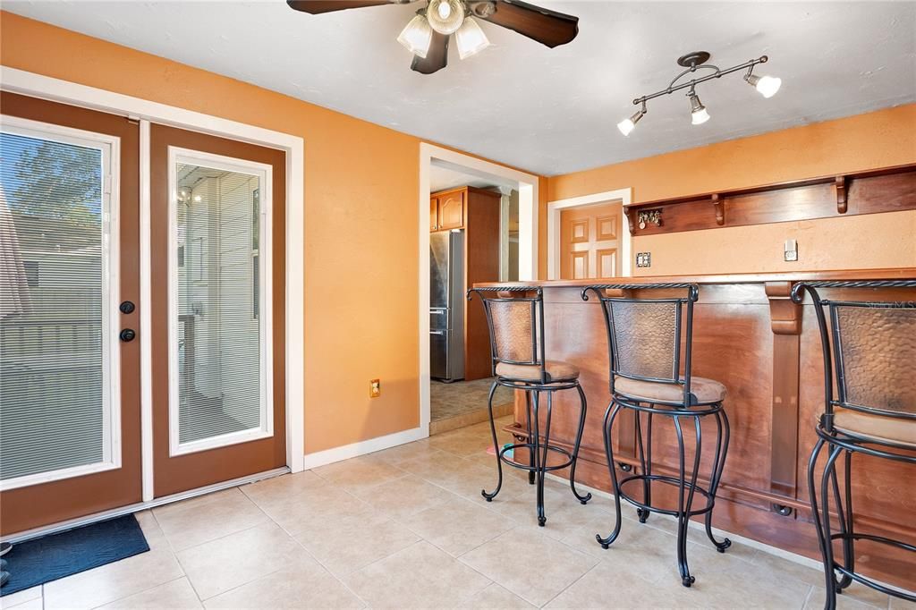 Family Room with Bar! French doors lead out to deck.