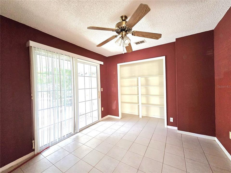 First bedroom & Entrance to screen enclosed patio area