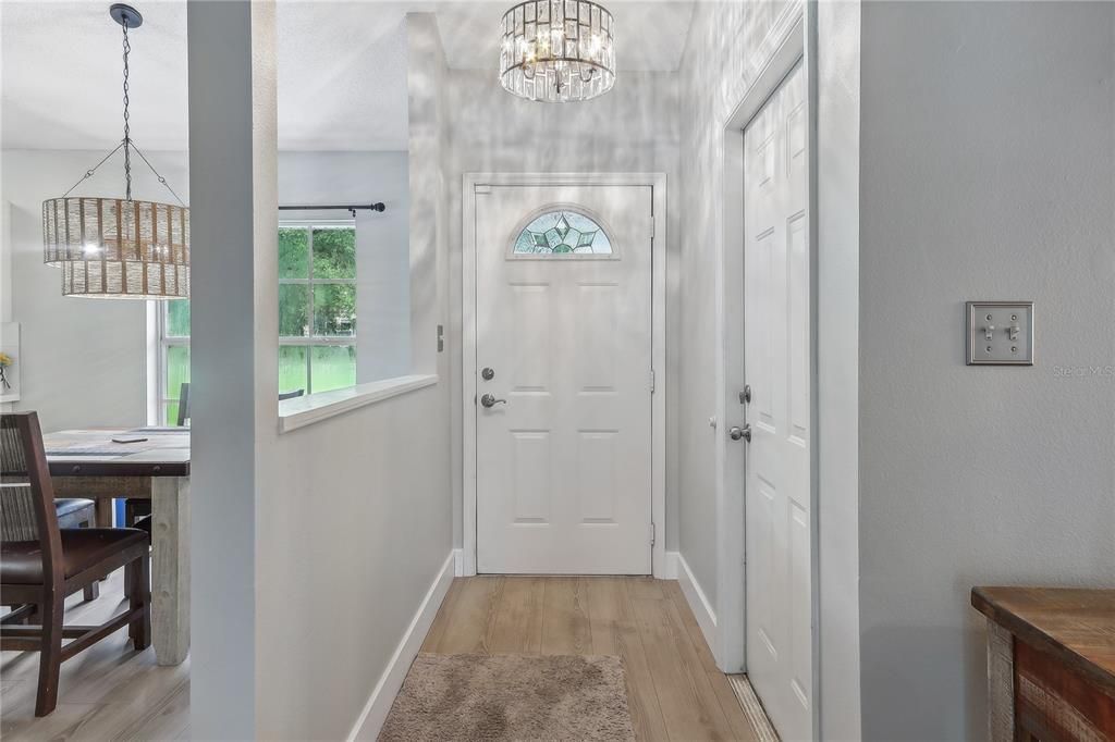 Walk in to this refreshed home with new lights, floors and fresh paint