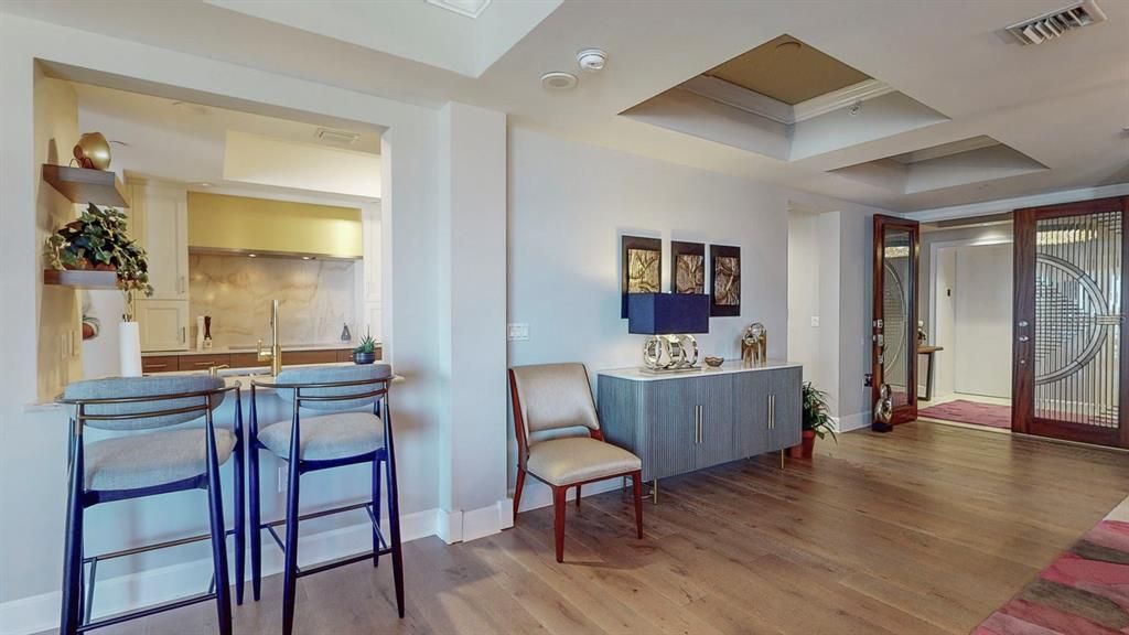 Entrance to open kitchen area with bar stools !