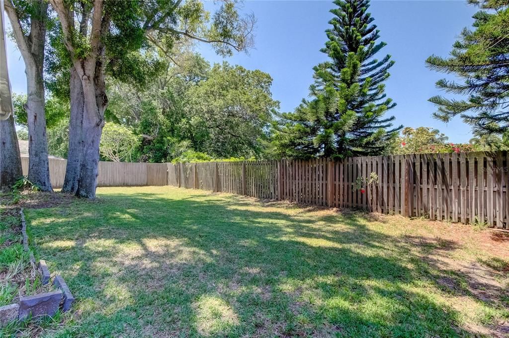 Private back yard with wood fence, no rear neighbors