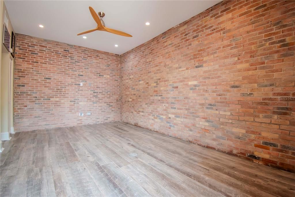 Blank Canvas of Casita - Chicago Bricks on 2 walls and plank tile flooring