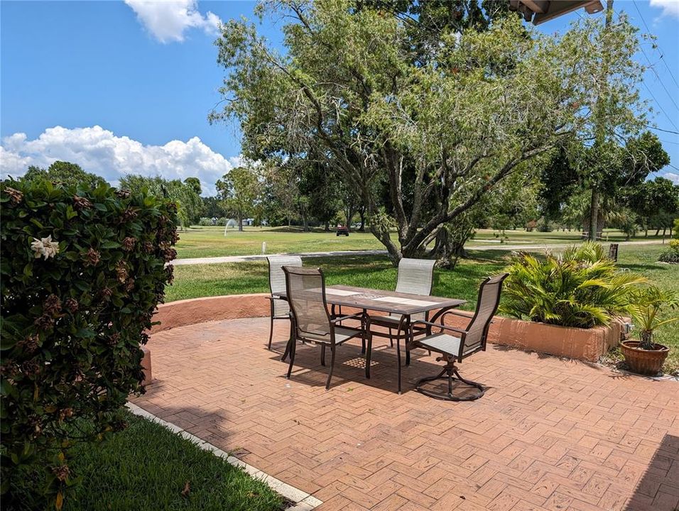 A back patio with amazing views of the 18th Hole of public Mainlands Golf Club.