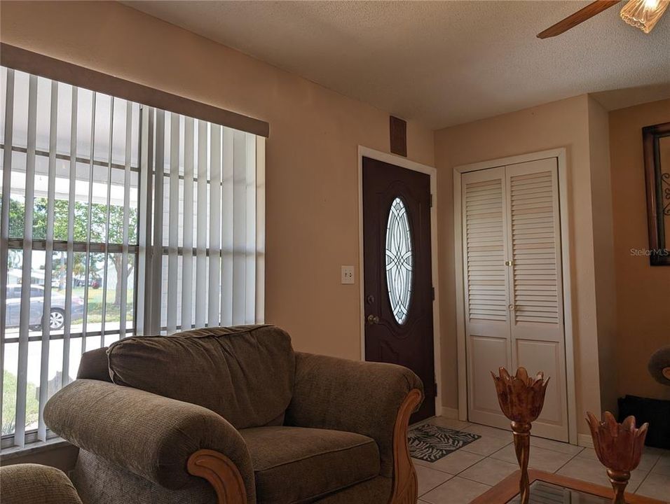 View of front entry and front coat closet.