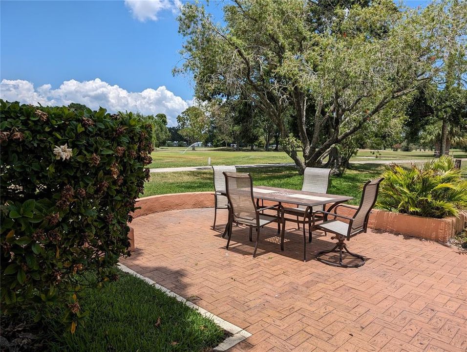 Stunning backyard view of Mainlands Golf Club from pavered patio.