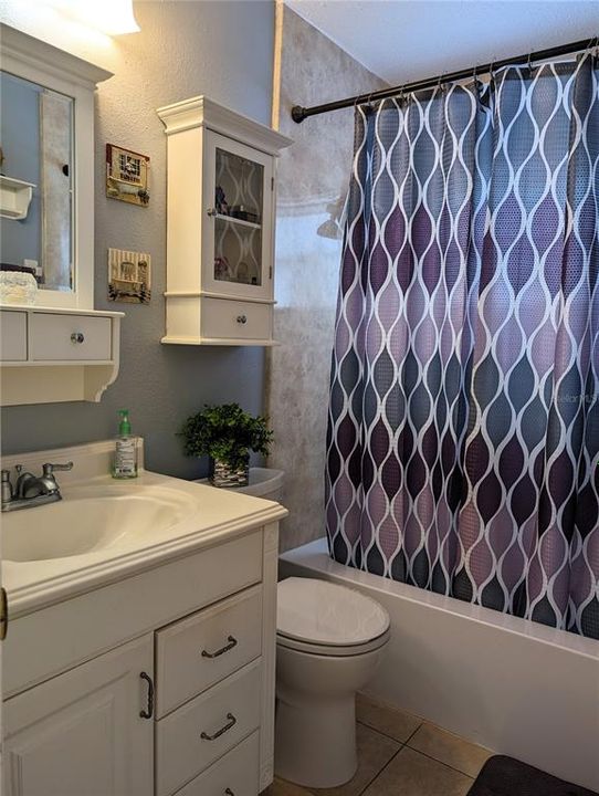 Bathroom updates include vanity/sink, taller commode, light/vent fixtures, tub surround, tile floor and mirror w/shelf.