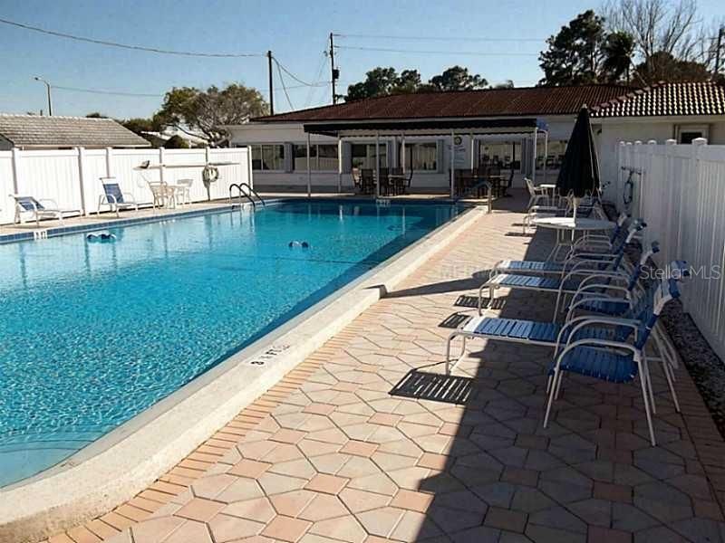 The beautifully maintained crystal-clear pool with privacy fence.  Relax in the sun, socialize with friends or take a cooling dip in the pool.  Whatever floats your boat!