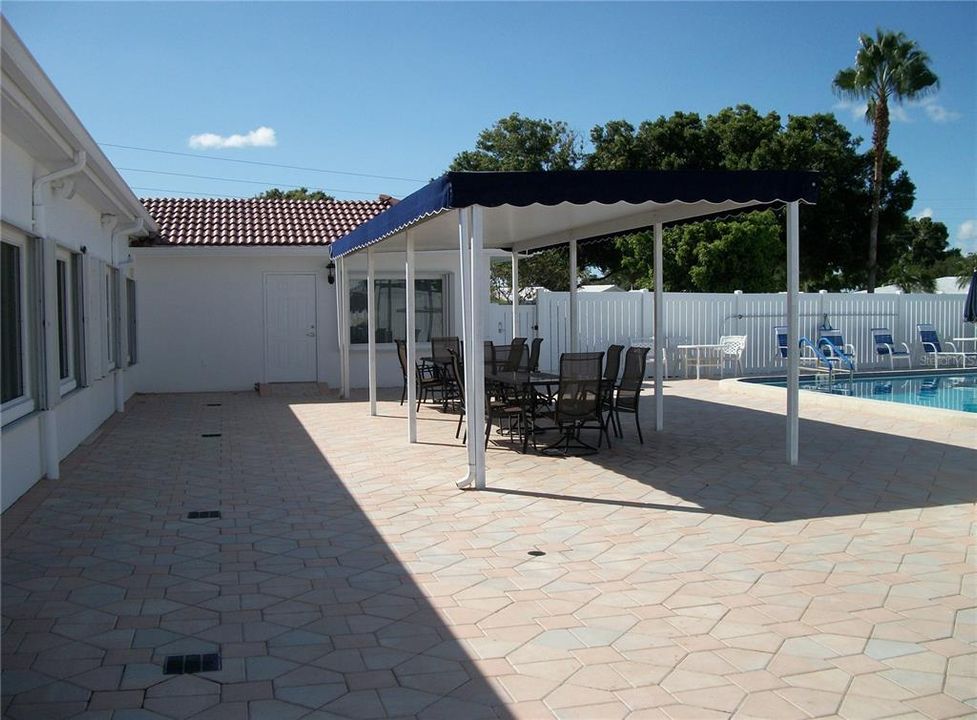 Covered seating area to enjoy the pool area.