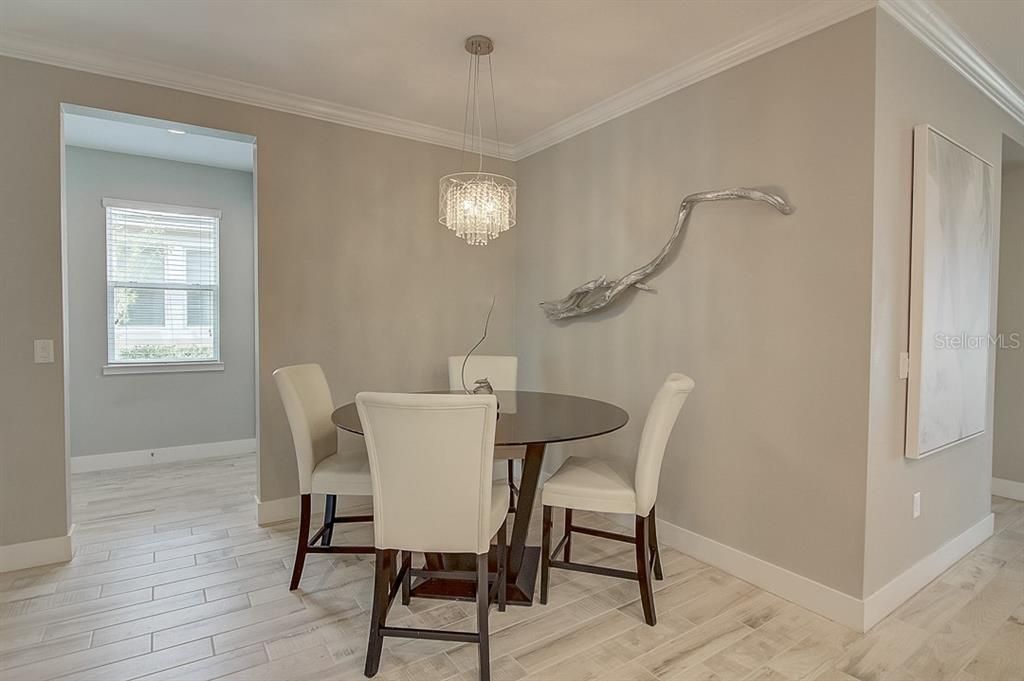 dining area with laundry back to the right and a dry bar or desk area back to the left