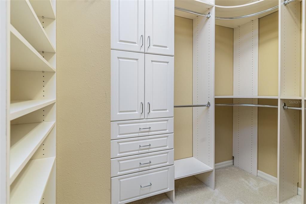 Primary Bedroom Walk-In Closet with Storage Systems