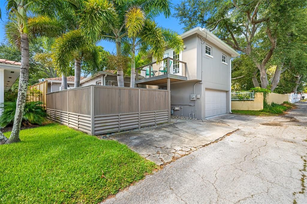 large parking pad outside of garage