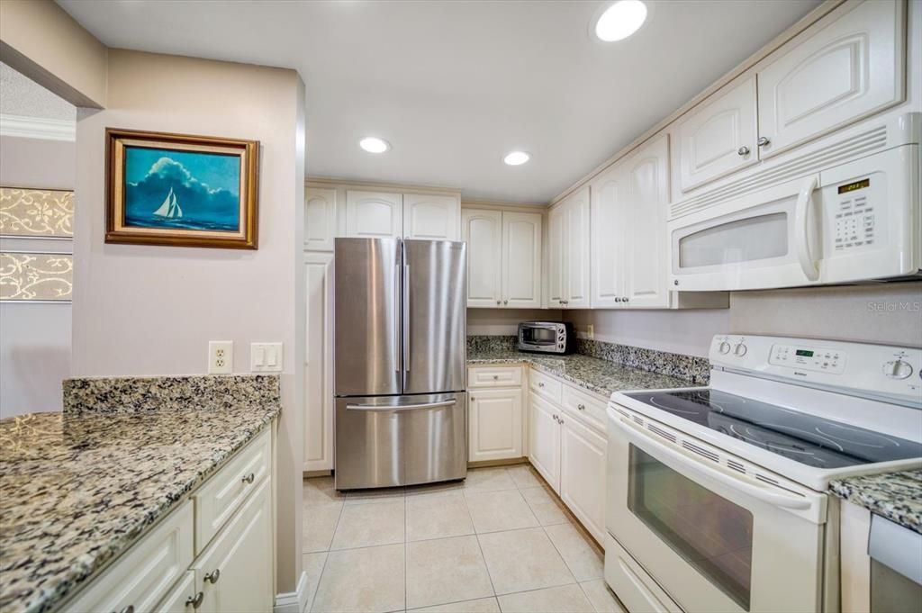 Closet pantry and additional storage under breakfast bar.