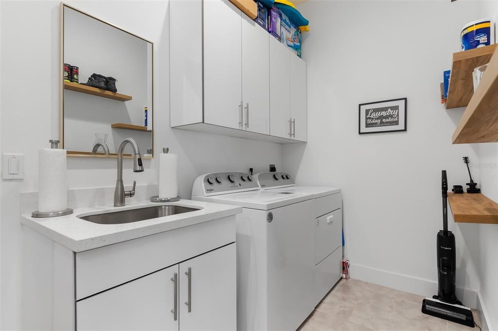 Laundry room right off the kitchen & garage